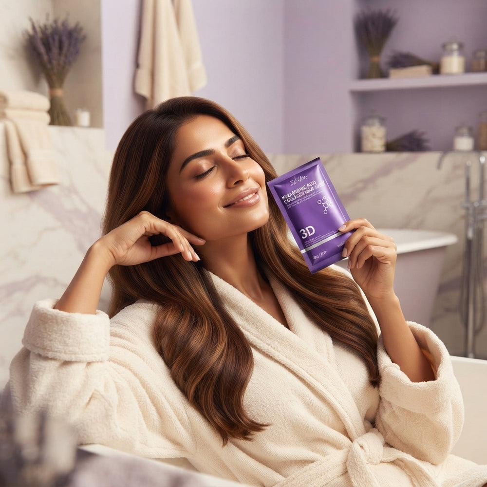 South Asian woman with healthy hair holding a hair repair mask sachet in a luxurious spa-themed bathroom with lavender and cr